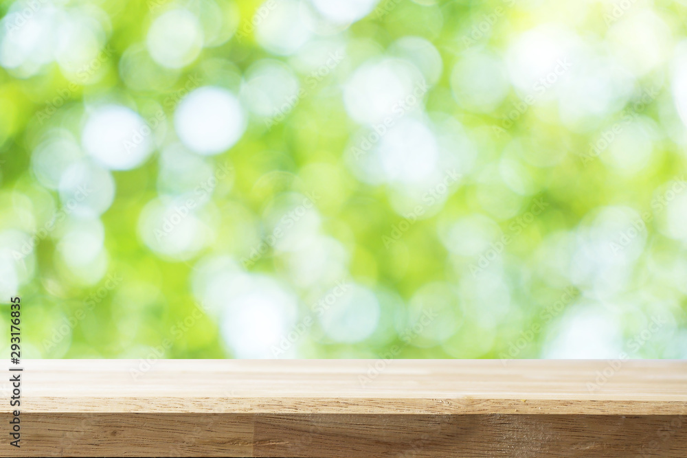 Empty wooden Brown table and blurred garden bokeh background. Mock up for display or montage of product,Business presentation. Empty wooden Brown table and blurred garden bokeh background. Mock up for display or montage of product,Business presentation.