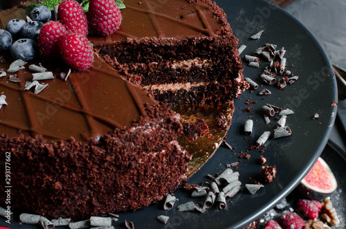 chocolate cake with fresh berries and nuts