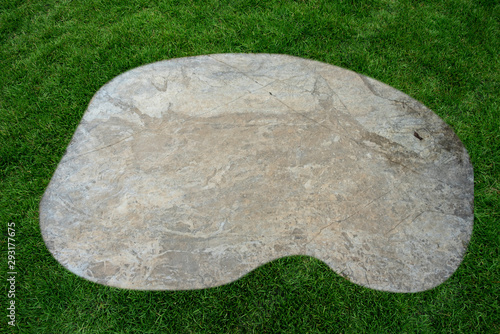 Floor slabs on the lawn. marble on green grass background. photo