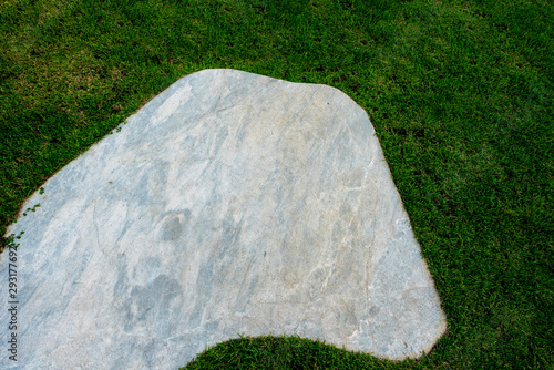 Floor slabs on the lawn. marble on green grass background. photo