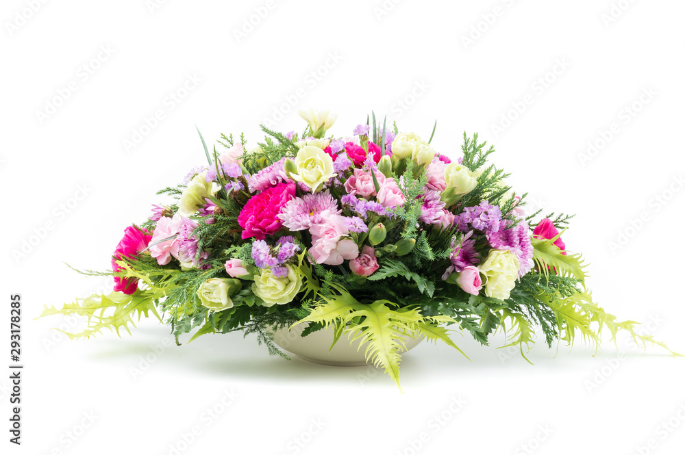 Bouquet of colorful carnation flowers in white vase isolated on white Bouquet of colorful carnation flowers in white vase isolated on white