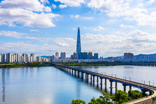 Skyline of Subway and Han gang River. Aerial view cityscape of Seoul, South Korea. Aerial Viewpoint  Lotte tower. Beautiful clouds © Toowongsa