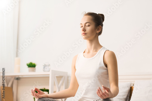 Fototapeta Naklejka Na Ścianę i Meble -  Calm morning. Woman doing yoga in lotus position