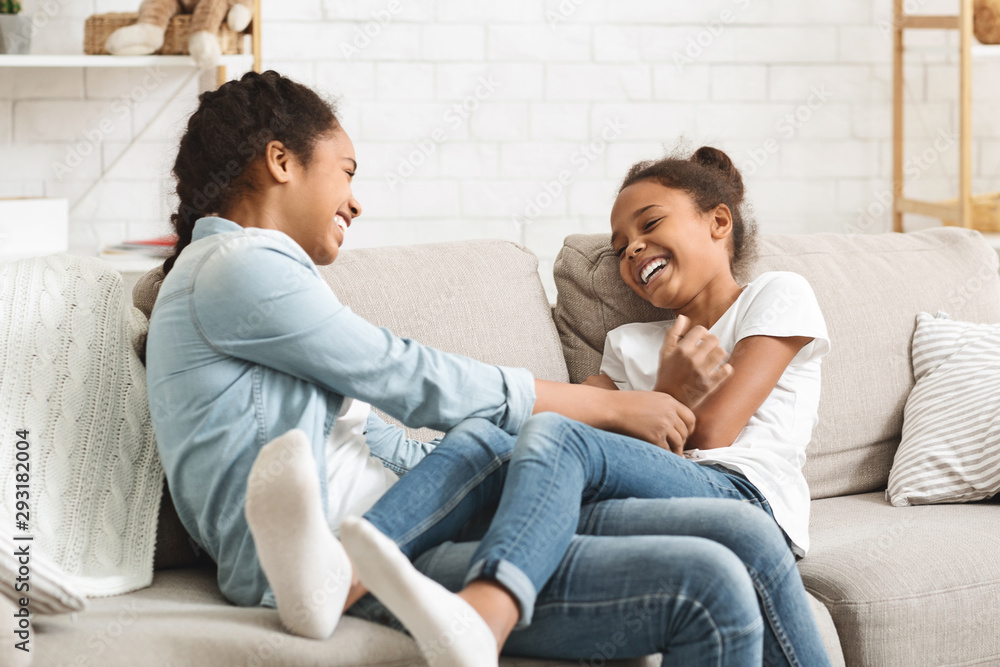 Cute black sisters having fun together at home Cute black sisters having fun together at home