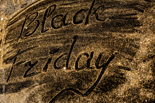 Sparkling inscription Black Friday on a black background photo