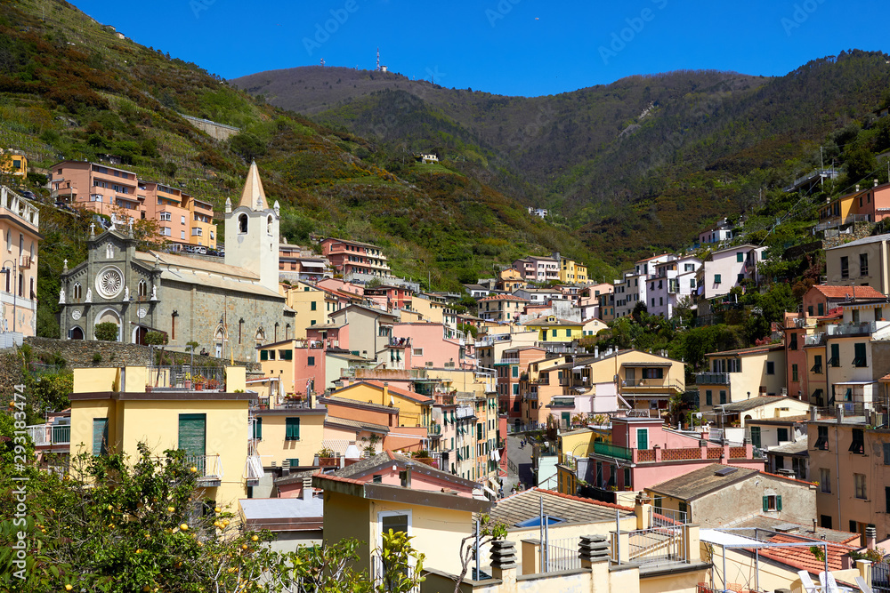 View of the houses in the Riomaggiore town. One of five famous centuries-old colorful villages of Cinque Terre National Park in Liguria, region of Italy.