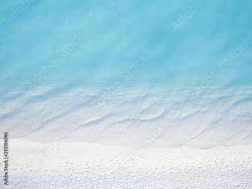 Aerial view of Beautiful crystal clear water and white beach