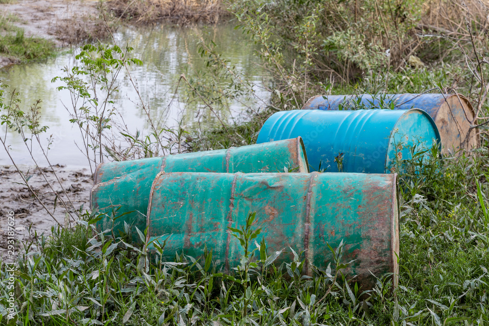 Old barrel in nature as hazardous garbige Old barrel in nature as hazardous garbige