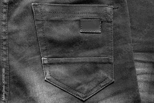 Black clothes label on clothes background, clothes with label tag, Black blank label on background,can used for display or montage your products, and your good for background.