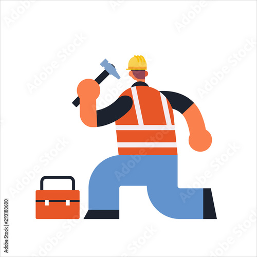 male builder using hammer and toolbox busy workman industrial construction carpenter worker in uniform building concept rear view flat full length