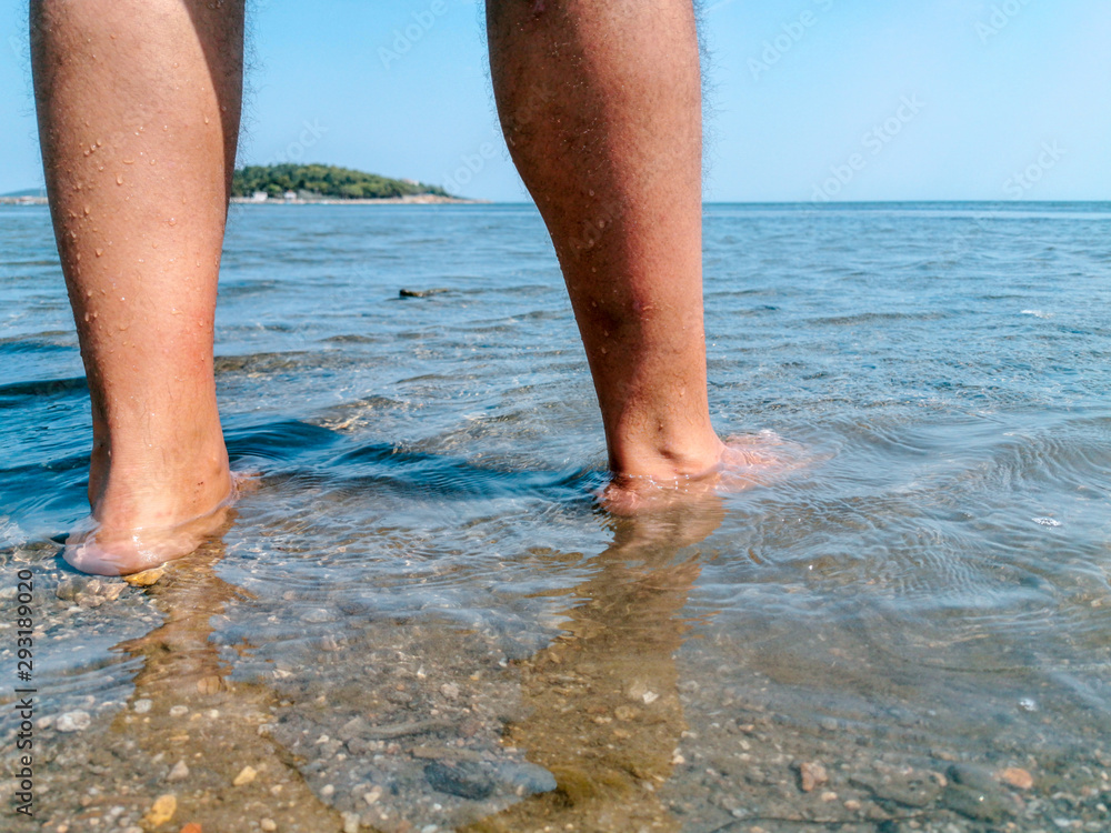 tourist man at the beach go into the sea tourist man at the beach go into the sea