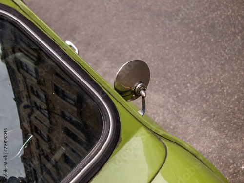 Vintage green car detil of the rear mirror photo