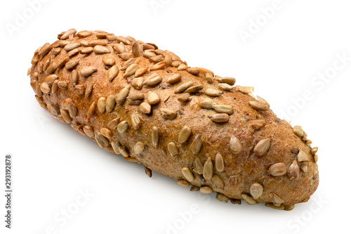 Long whole wheat bread roll with sunflower seeds isolated on white.