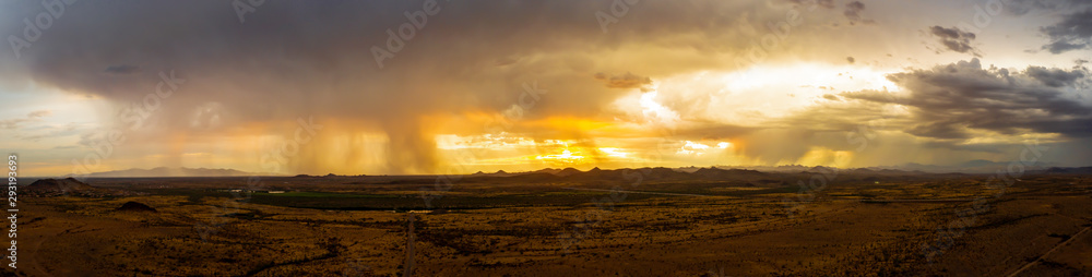 A panorama of a monsoon at sunset over the Sonoran desert of Arizona.