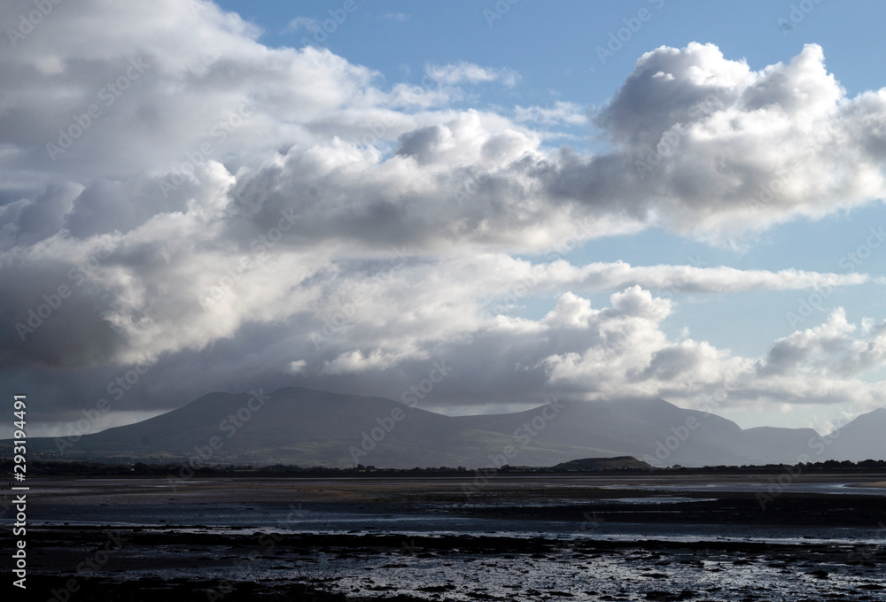 Wales – the northern coastline. A stormy autumn day with angry clouds passing over distant mountains, near Caernarfon.