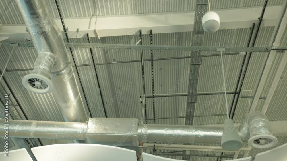 air duct ventilation pipes on ceiling of big industrial building air duct ventilation pipes on ceiling of big industrial building