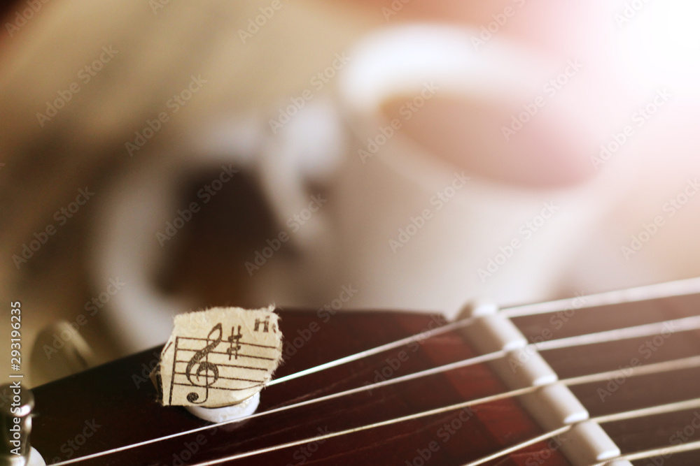 Guitar strings, torn paper notes and a Cup of coffee, music Stock Photo |  Adobe Stock