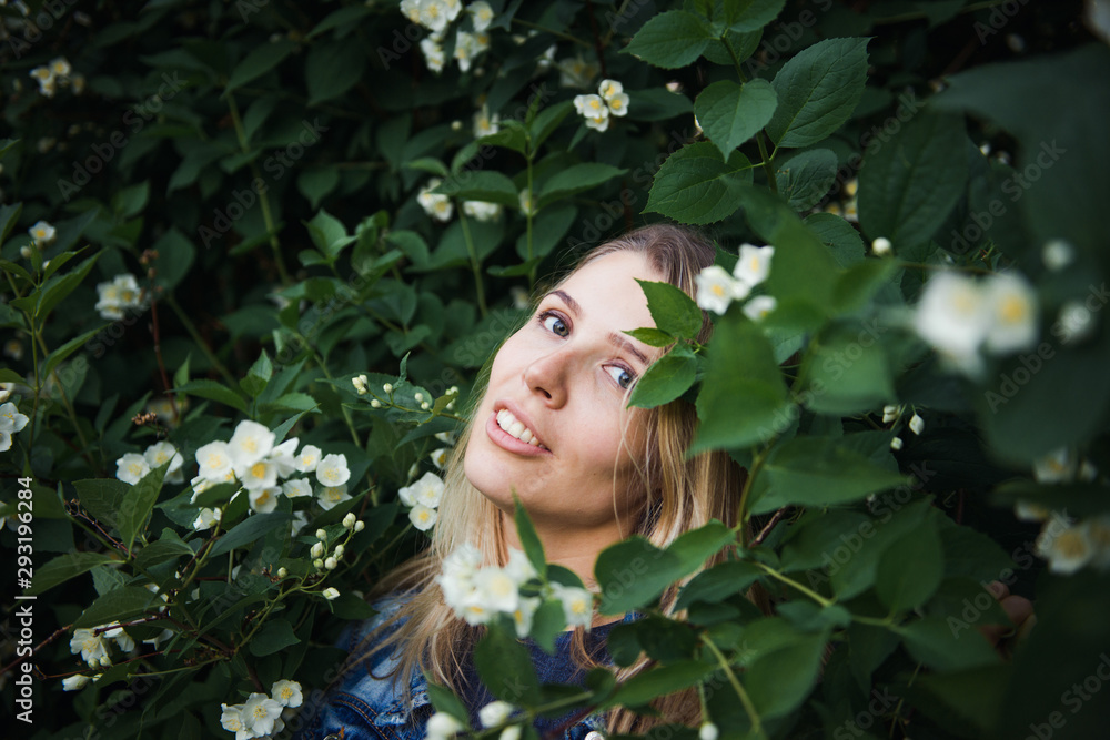 Beautiful blonde in the bushes of Jasmine Beautiful blonde in the bushes of Jasmine