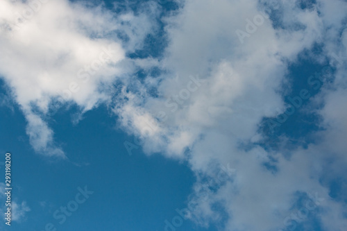 white clouds in the blue sky during