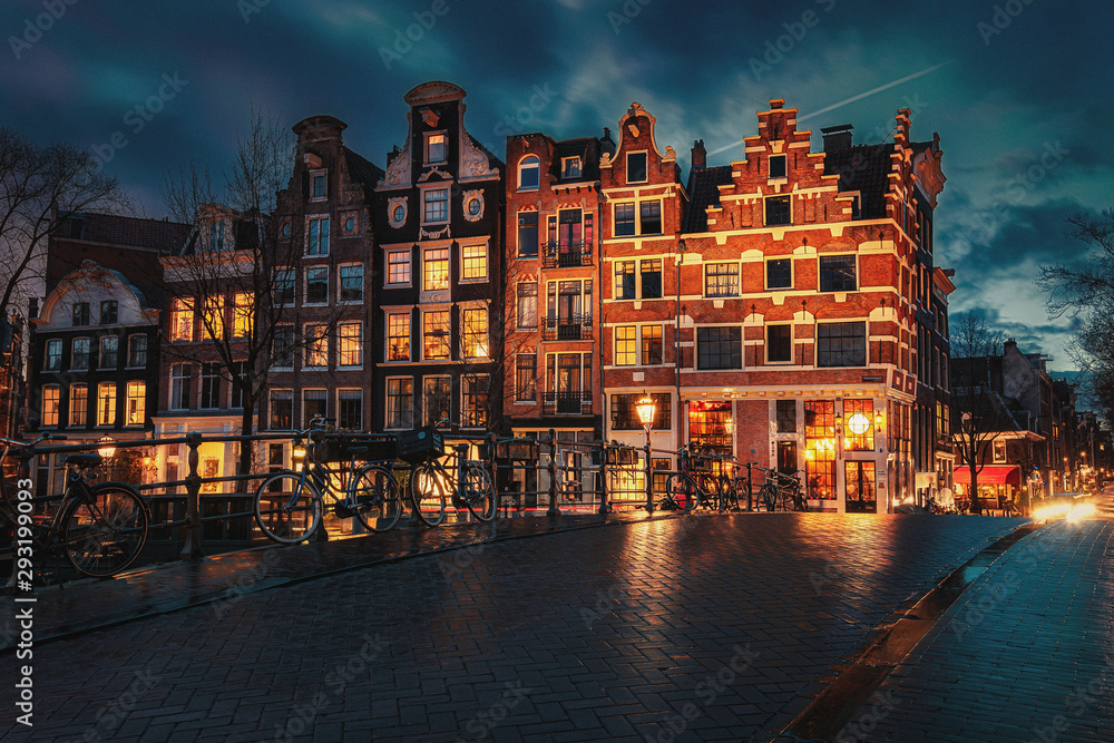 Beautiful canal houses on the corner of Brouwersgracht and Prinsengracht in the old center of Amsterdam during sunset