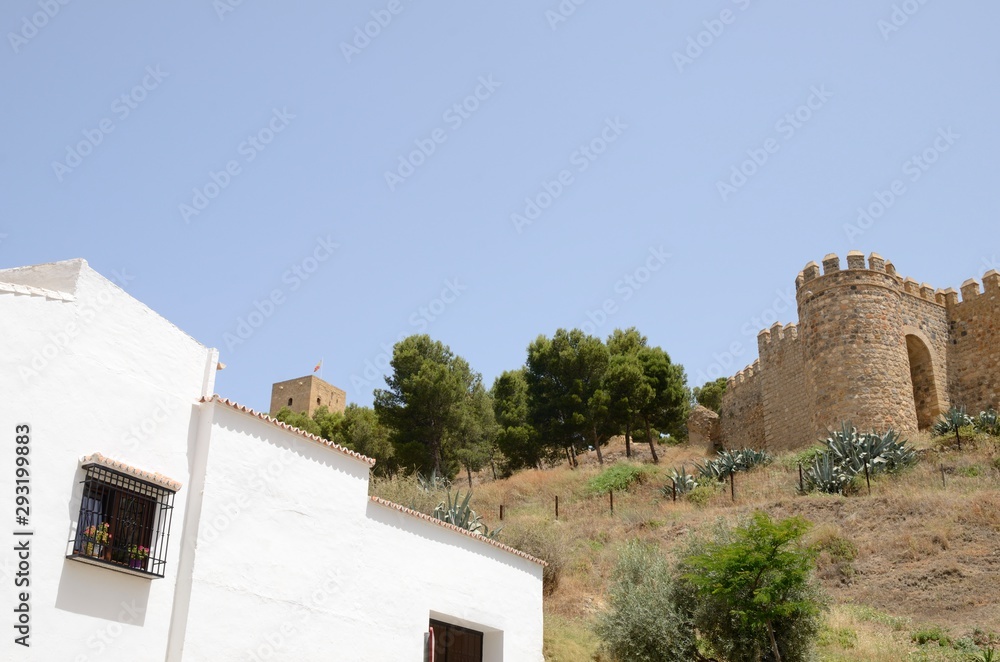White house and historic fort in Antequera, Andalusia, Spain