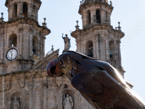 bronze parrot with pontevedra cathedral background