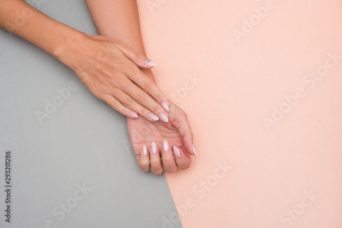 Fototapeta Naklejka Na Ścianę i Meble -  Stylish trendy female manicure. Beautiful woman's hands on soft background.