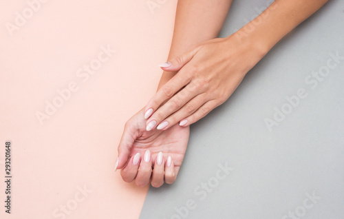 Stylish trendy female manicure. Beautiful woman's hands on soft background.