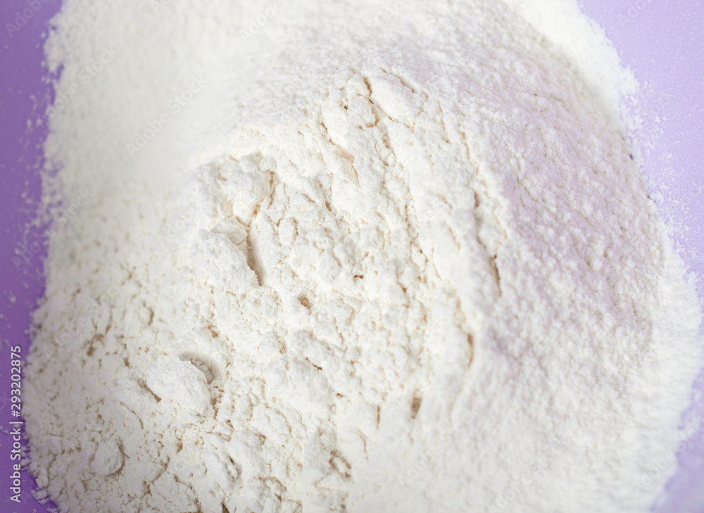 Wheat white flour in cooking bowl bakery, close up Wheat white flour in cooking bowl bakery, close up