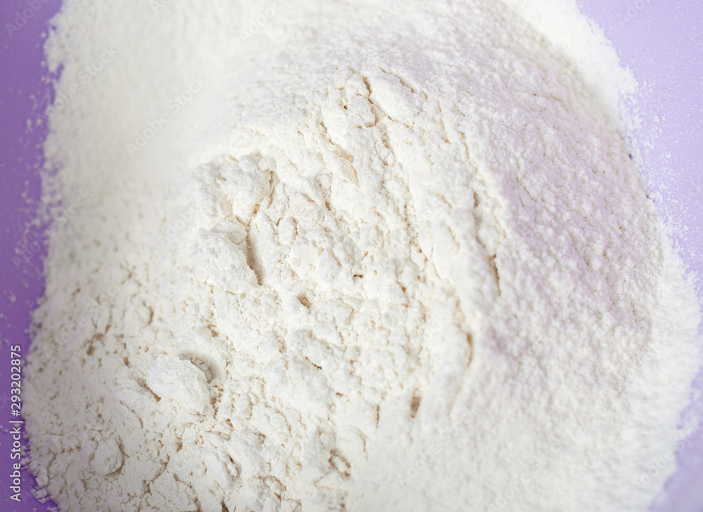 Wheat white flour in cooking bowl bakery, close up