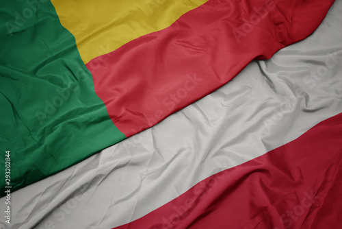waving colorful flag of poland and national flag of benin.