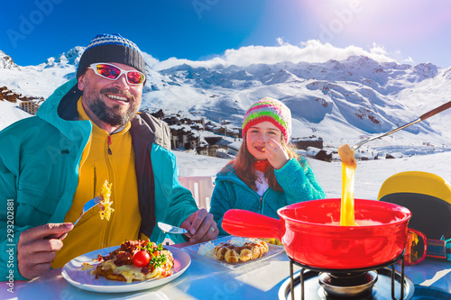 Ski restaurant lunch break with Fondue cheese, mountain view of Val Thorens, 3 valleys , France.