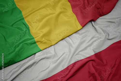 waving colorful flag of poland and national flag of mali.