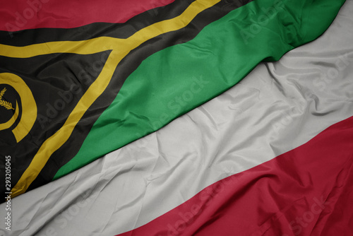 waving colorful flag of poland and national flag of Vanuatu .