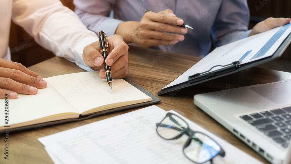 Business team brainstorming and discussing with financial data and report graph. Teamwork meeting working concept. Business team brainstorming and discussing with financial data and report graph. Teamwork meeting working concept.