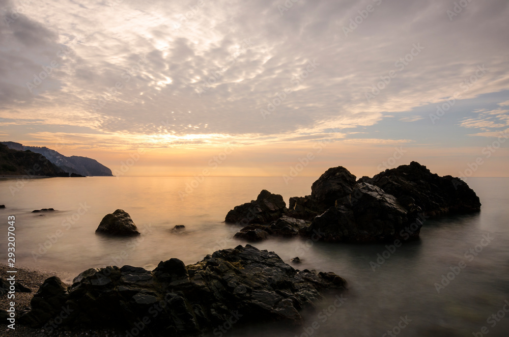 Obraz premium Sunrise at the Playa de las Alberquillas and Molino de Papel (Costa del Sol de Málaga), in a fantastic natural setting