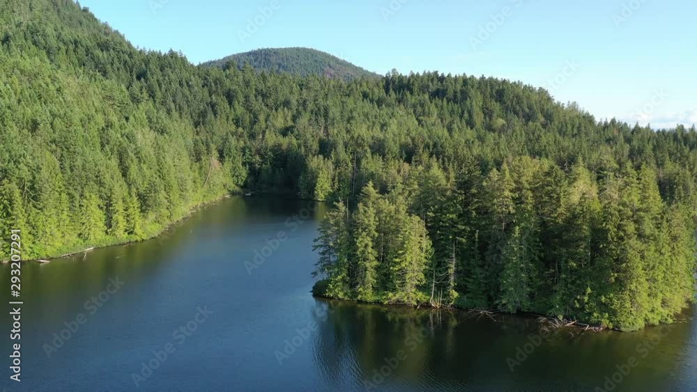 Aerial View at Mountain Lake with Blue Sky in British Columbia, Canada. 4K. Aerial View at Mountain Lake with Blue Sky in British Columbia, Canada. 4K.