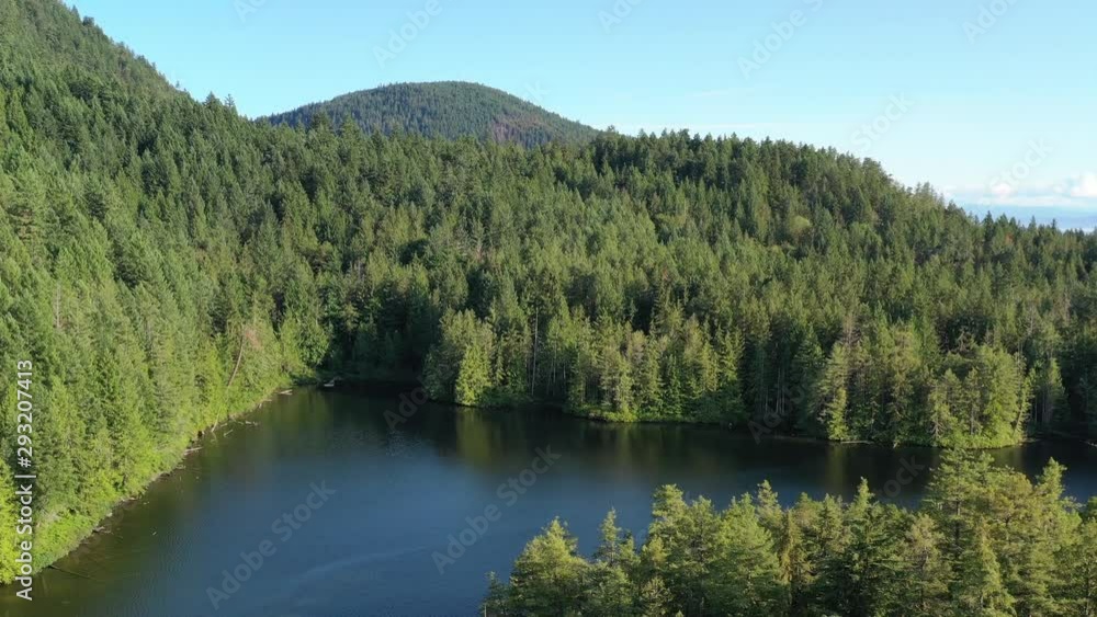 Aerial View at Mountain Lake with Blue Sky in British Columbia, Canada. 4K. Aerial View at Mountain Lake with Blue Sky in British Columbia, Canada. 4K.