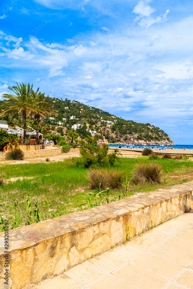 Coastal walkway to beach in beautiful bay of Cala Sant Vicent, Ibiza island, Spain