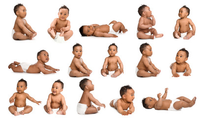 Cute little baby crawling on white background