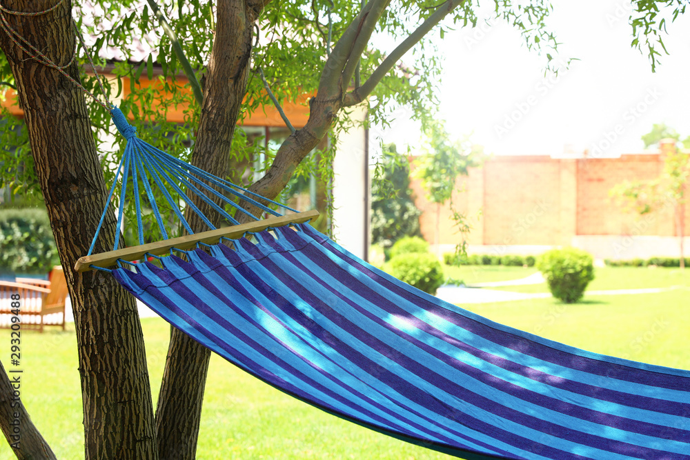 Comfortable blue hammock outdoors on sunny day