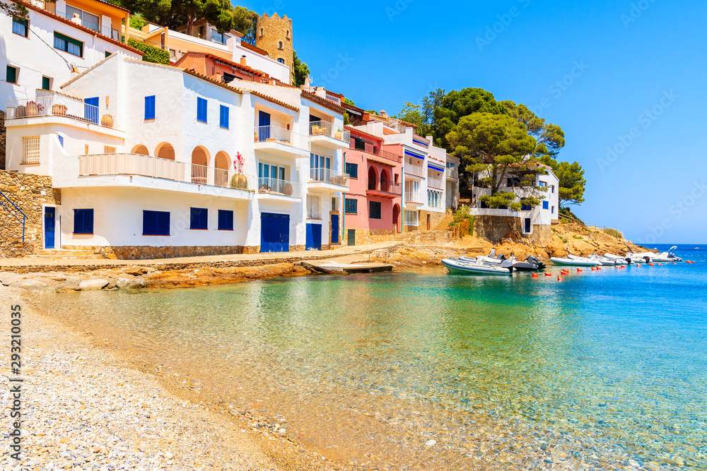Beautiful beach in Sa Tuna village with colorful houses on shore, Costa Brava, Catalonia, Spain