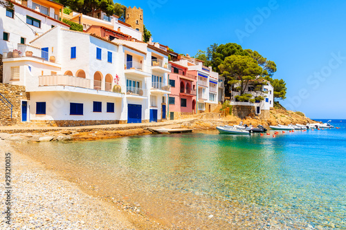 Beautiful beach in Sa Tuna village with colorful houses on shore, Costa Brava, Catalonia, Spain