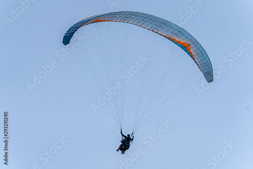 Paragliding flying on the hillside of Palomaret.
