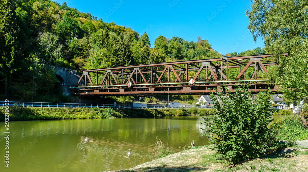 Fototapeta premium Idyllic Lahn River with Railway Bridge