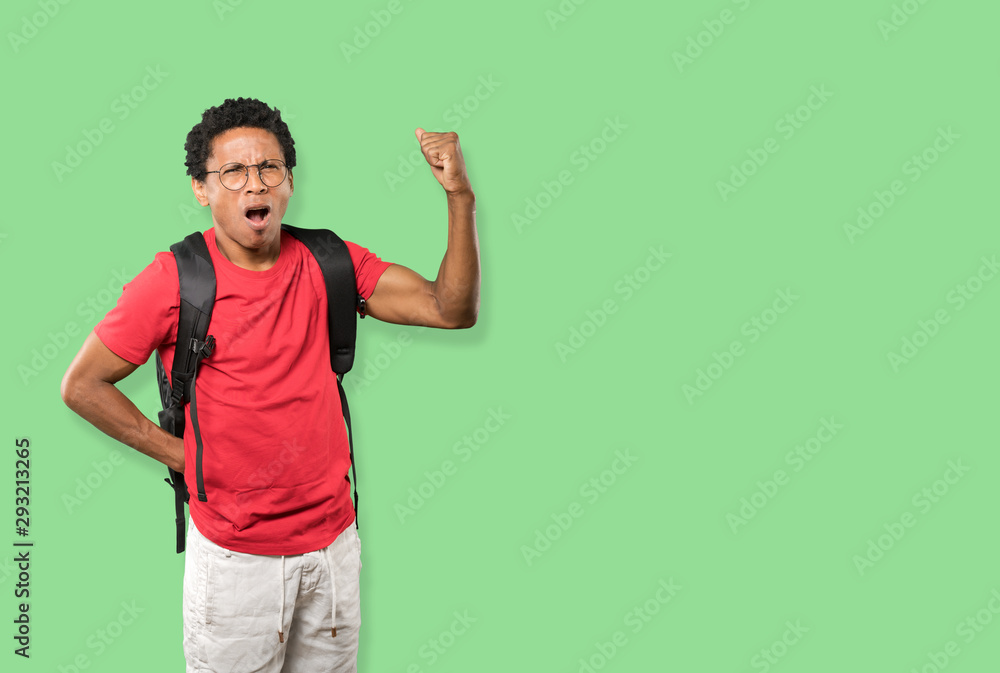 Upset young man doing a competitive gesture Upset young man doing a competitive gesture