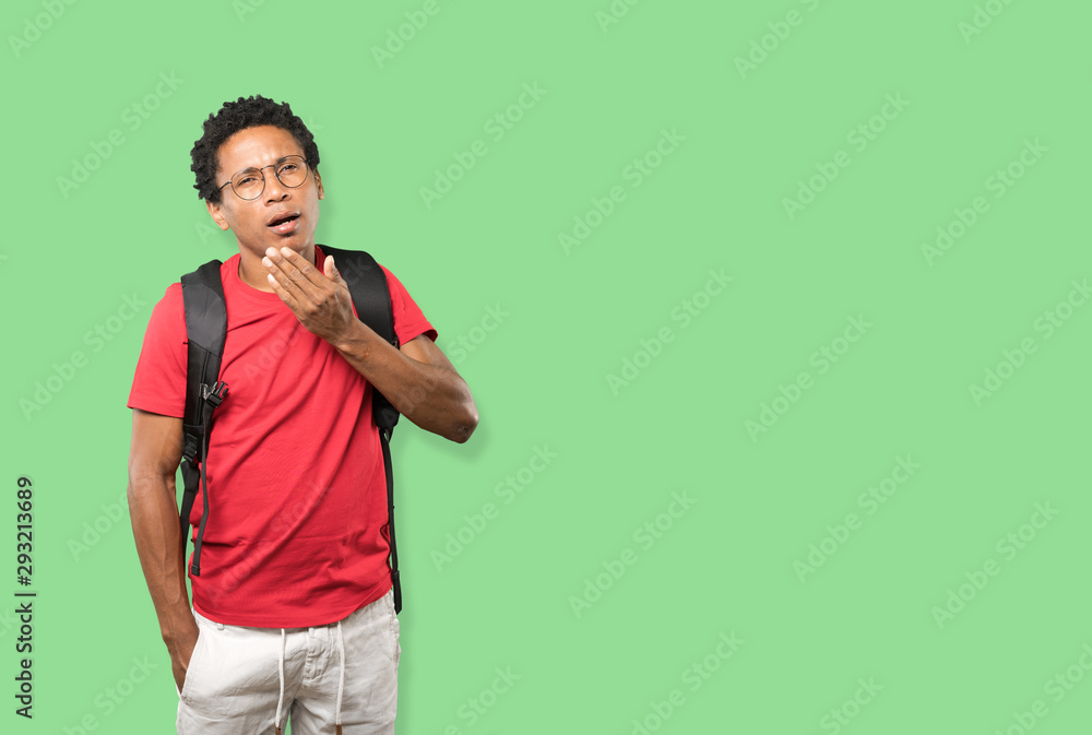 Friendly young man doing a gesture of keep calm Friendly young man doing a gesture of keep calm