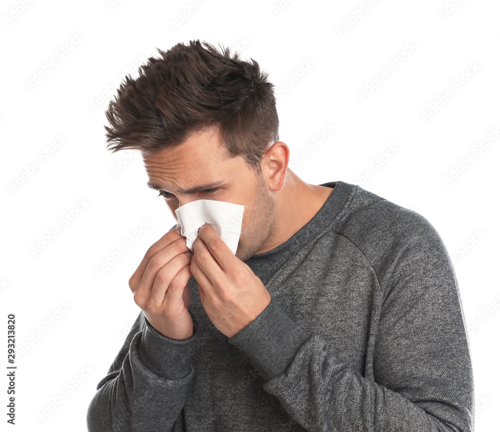 Young man suffering from cold on white background Young man suffering from cold on white background
