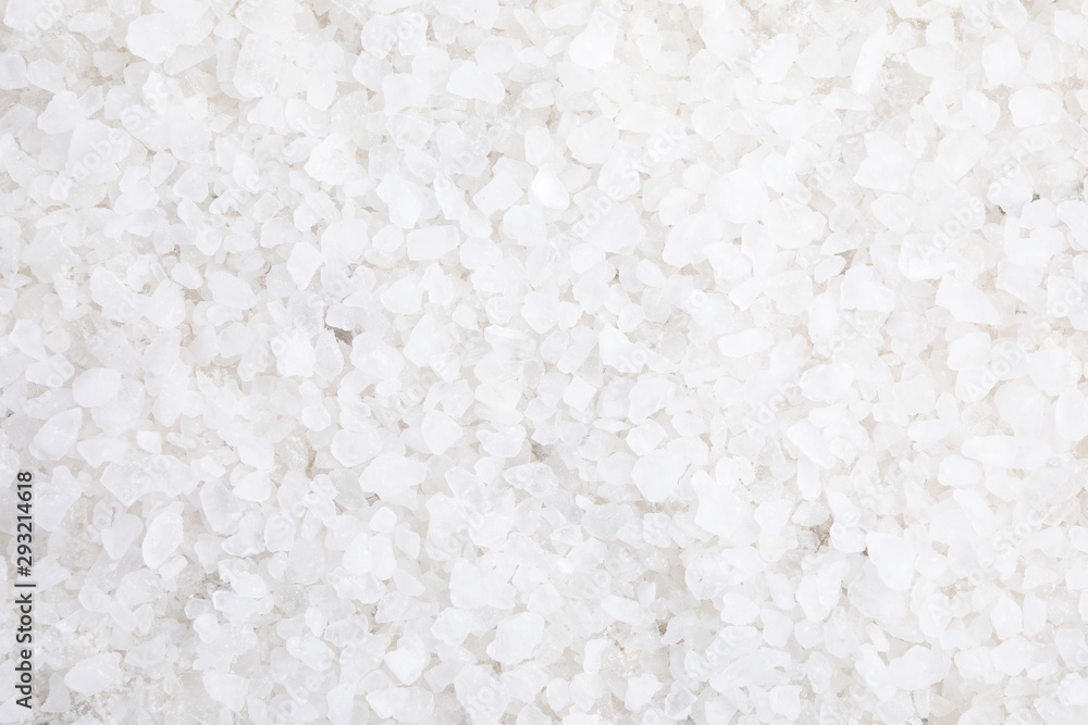 White sea salt as background, top view. Spa treatment White sea salt as background, top view. Spa treatment