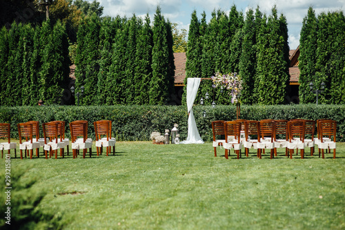 Arch for the wedding ceremony, decorated with cloth and flowers